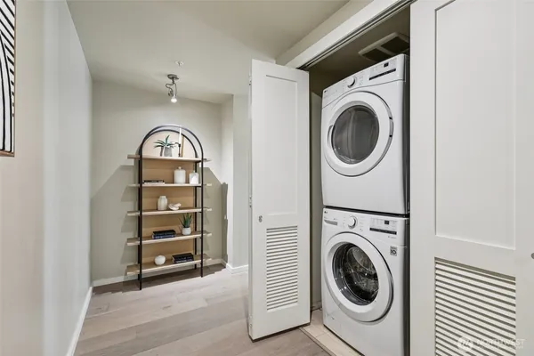 a view of a hallway with washer and dryer