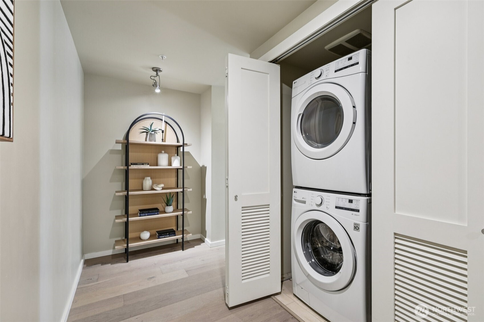 76 Cedar Street, Unit S1005 Seattle, WA 98121 - Photo 15 of 30 a view of a hallway with washer and dryer