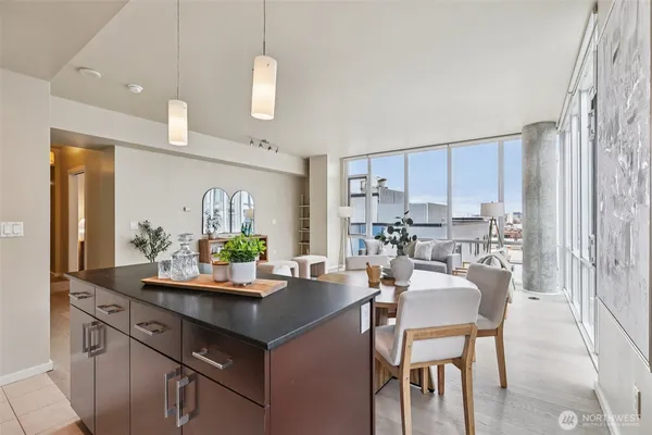 a kitchen with granite countertop a sink and cabinets
