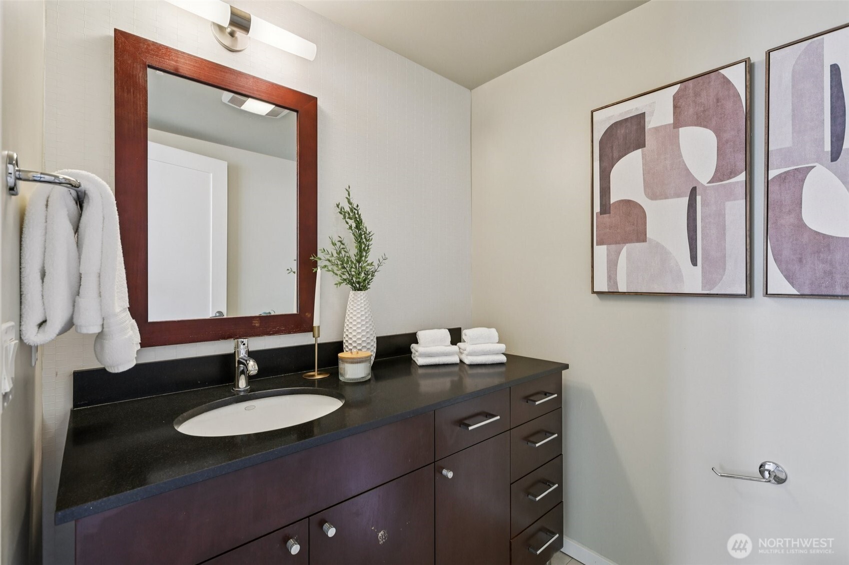 76 Cedar Street, Unit S1005 Seattle, WA 98121 - Photo 8 of 30 a bathroom with a sink and a mirror