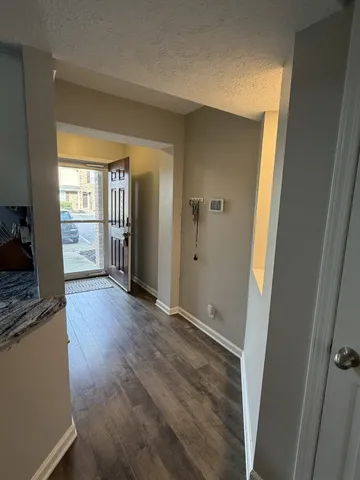 wooden floor in an empty room and a window