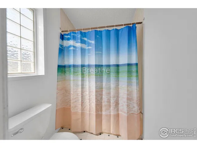 a view of wooden floor and a cabinet