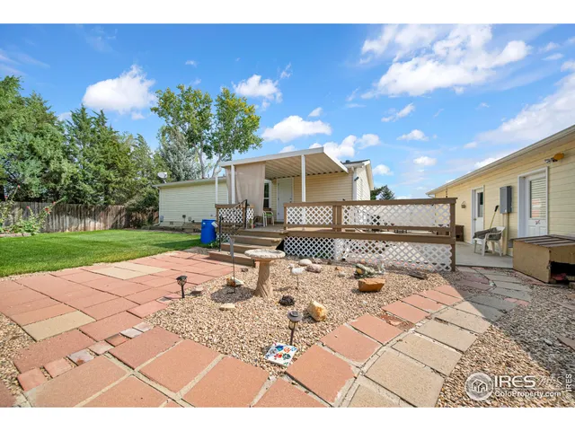 a view of a backyard with a patio