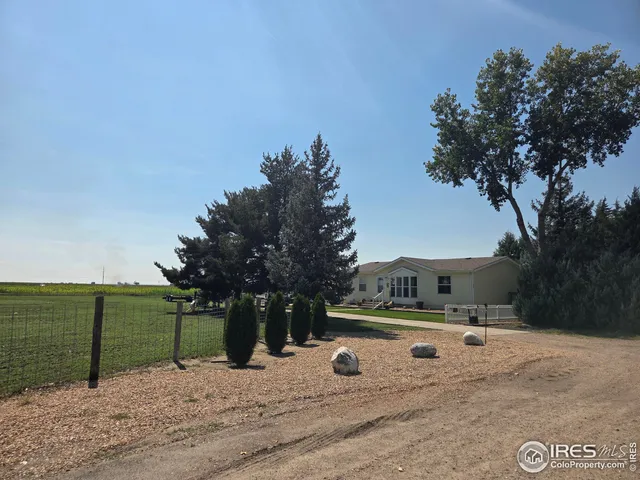 a view of swimming pool with a yard