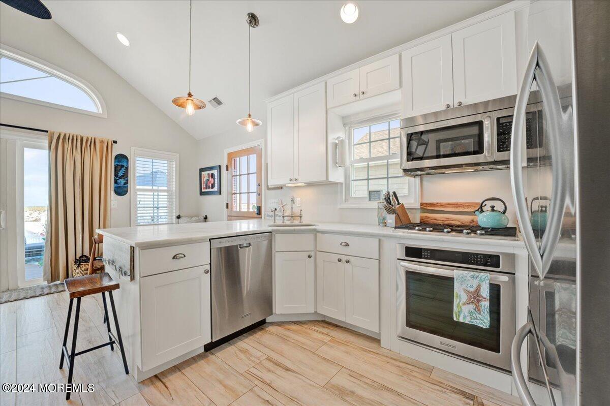 3326 Seaview Road Lavallette, NJ 08735 - Photo 6 of 27 a kitchen with stainless steel appliances granite countertop a stove and a sink