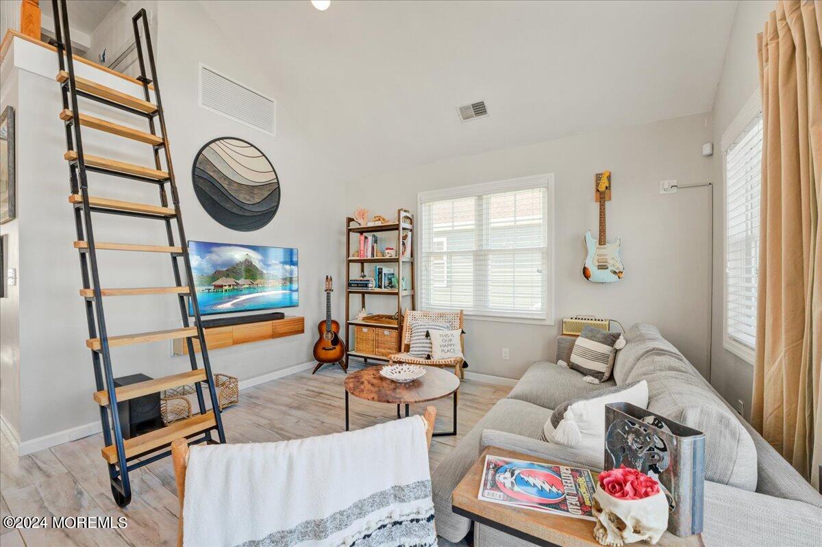 3326 Seaview Road Lavallette, NJ 08735 - Photo 9 of 27 a living room with furniture and a mirror