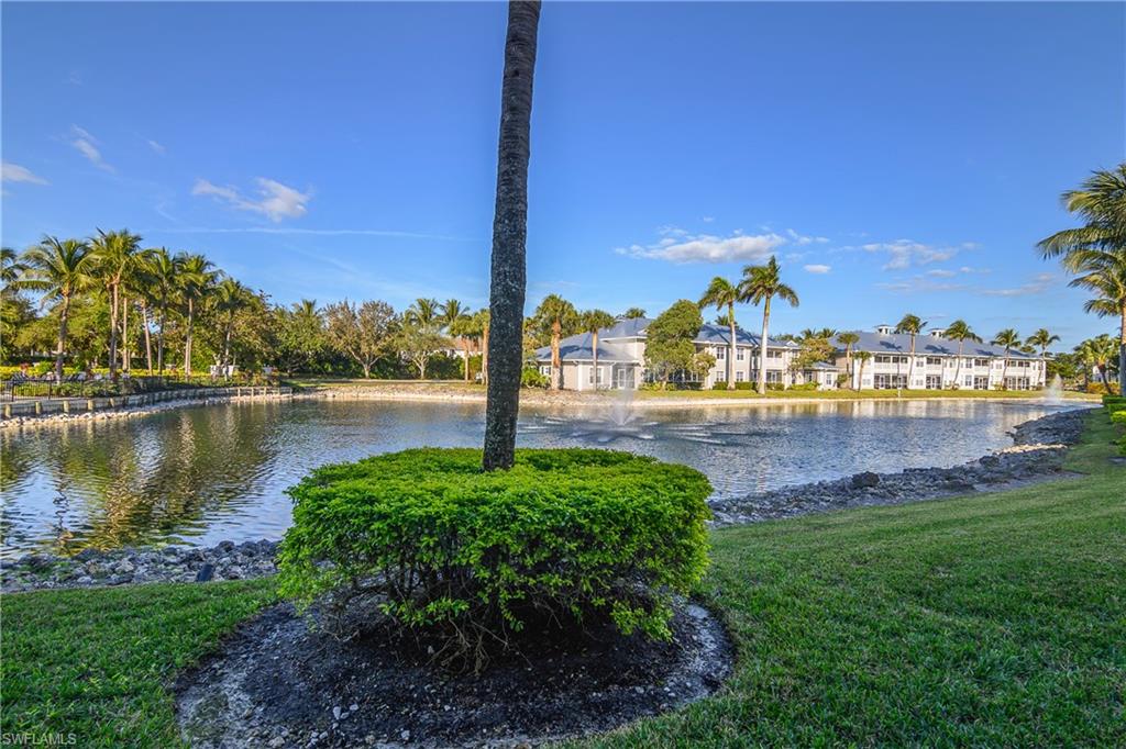 7930 Mahogany Run Lane, Unit 814 Naples, FL 34113 - Photo 23 of 33 a view of a lake with a yard