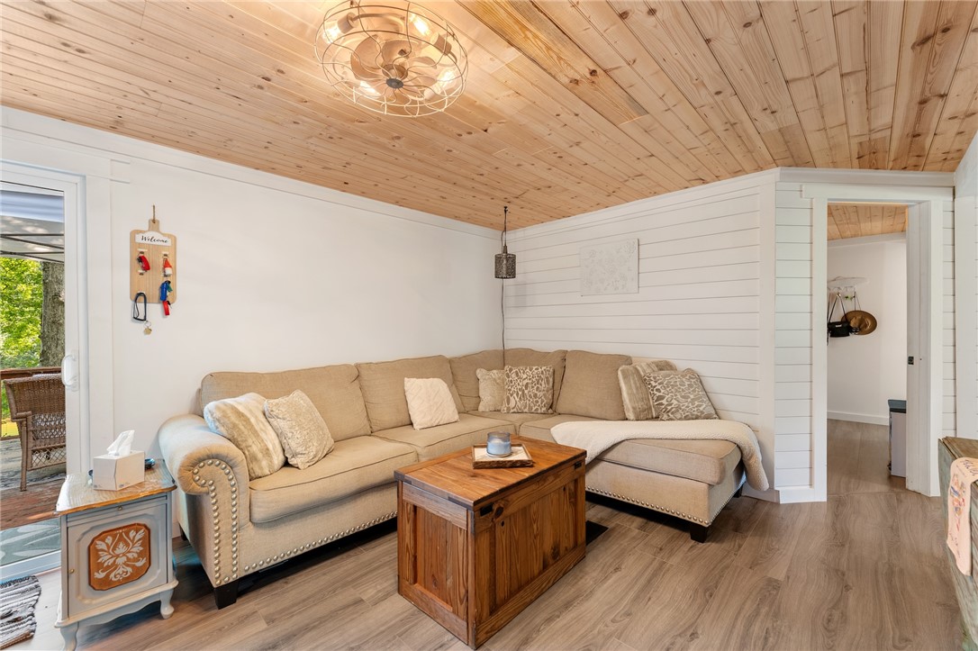 30 Mobleys Bluff Road Abbeville, SC 29620 - Photo 9 of 35 Warm wood-planked ceilings and classic shiplap walls create an inviting architectural backdrop.
