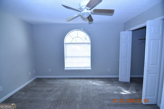 a white toilet sitting next to a bath tub