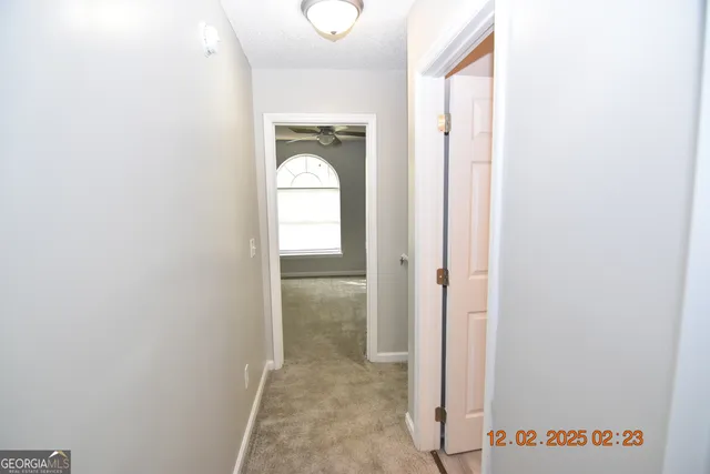 a view of a room that has a mirror in it