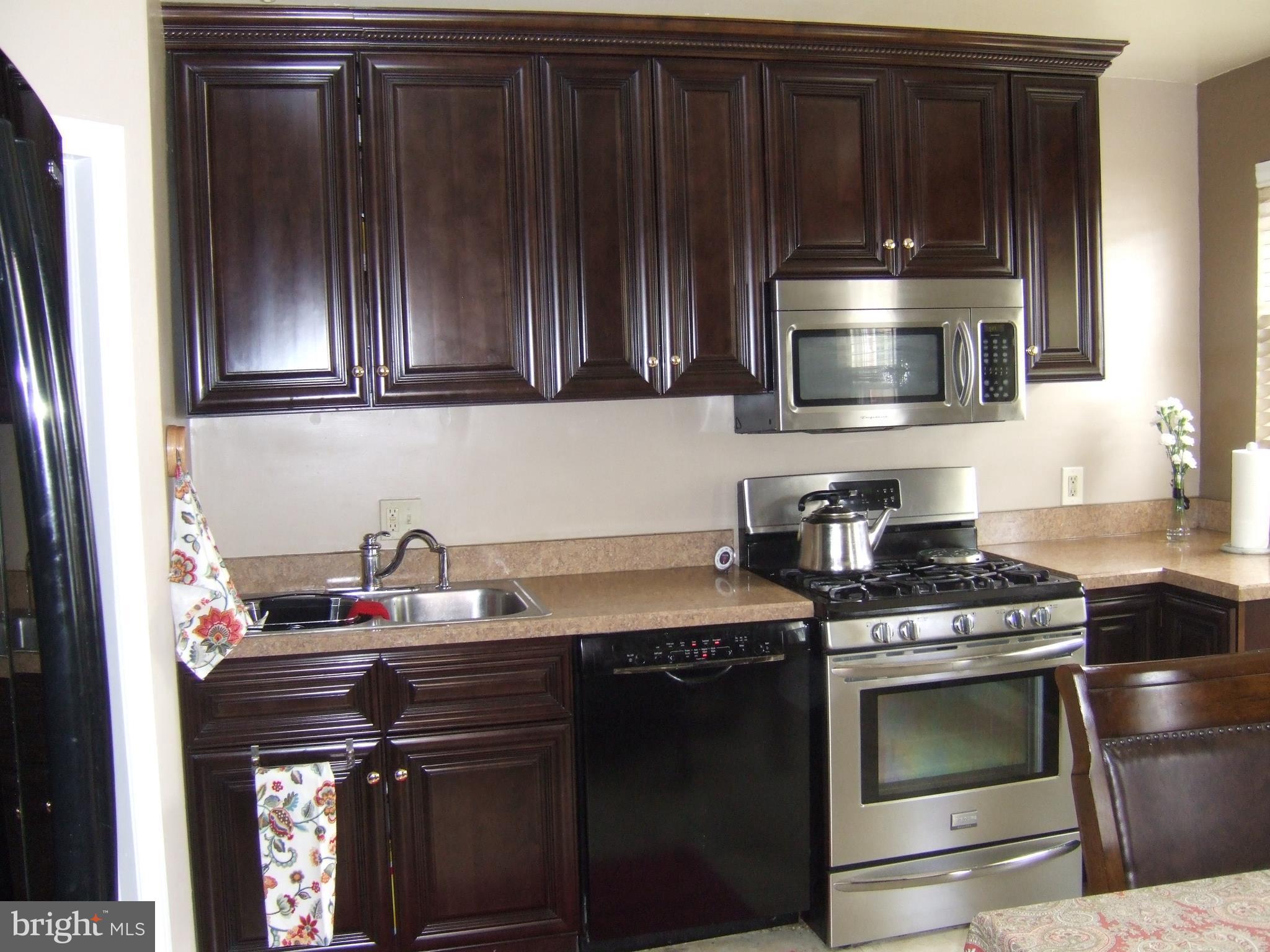 8546 Willow Oak Road Baltimore, MD 21234 - Photo 6 of 27 stainless steel stove and microwave