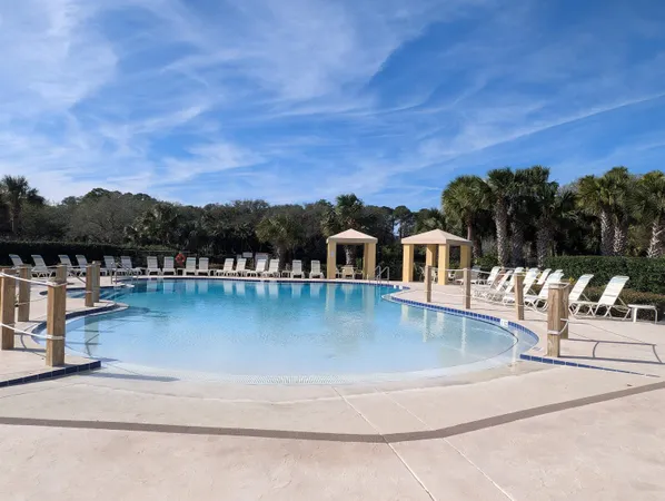 a view of a swimming pool with a lake view
