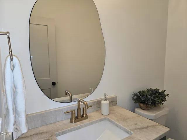 a living room with a fireplace and a wooden floor