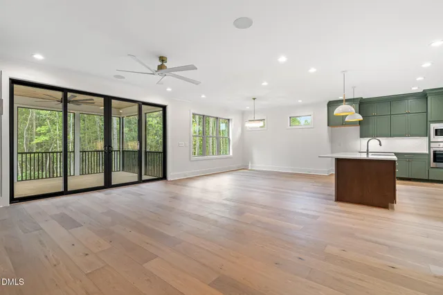 a kitchen with a cabinets and wooden floor