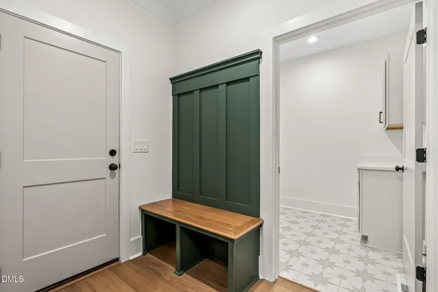 an empty room with a window and a ceiling fan