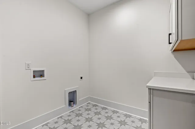 an empty room with closet and windows