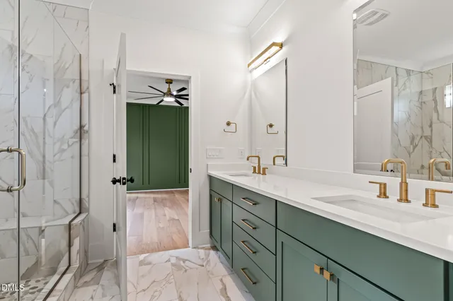 an empty room with a window and a ceiling fan