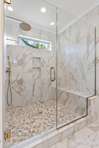 a view of room with window and ceiling fan