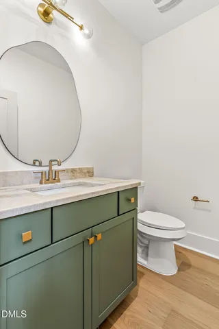 a kitchen with stainless steel appliances a sink a stove a refrigerator and cabinets