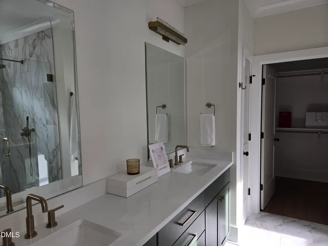 a bathroom with a sink and mirror