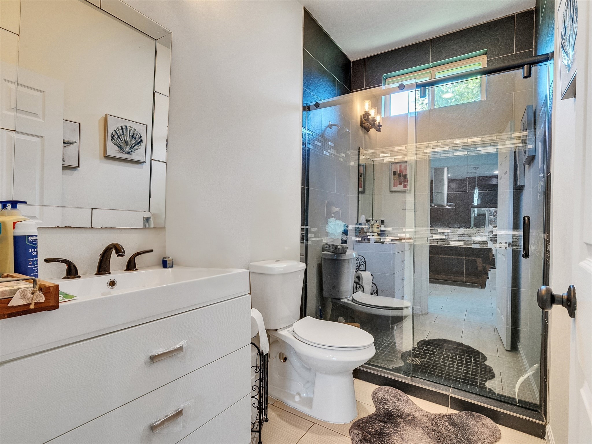 625 Pittman Road Richmond, TX 77469 - Photo 15 of 29 a bathroom with a toilet a sink and mirror