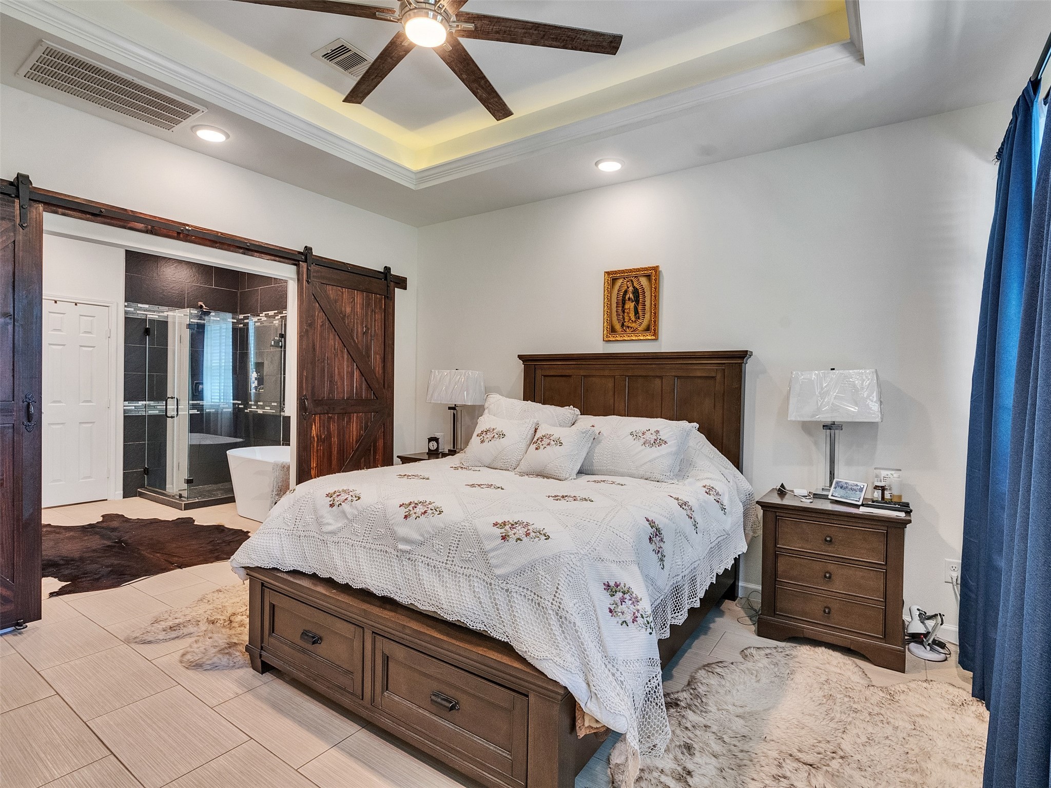 625 Pittman Road Richmond, TX 77469 - Photo 19 of 29 a bedroom with a bed and a chandelier