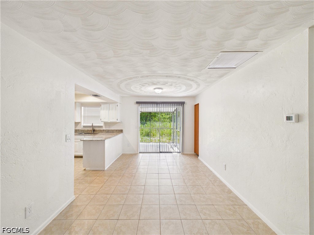 18541 Iris Road Fort Myers, FL 33967 - Photo 5 of 18 a view of a kitchen with a sink and a window