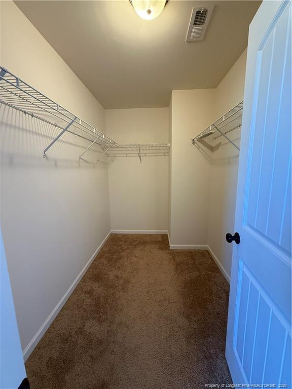 22 Raintree Lane Spring Lake, NC 28390 - Photo 19 of 25 a view of a room with racks on the wall