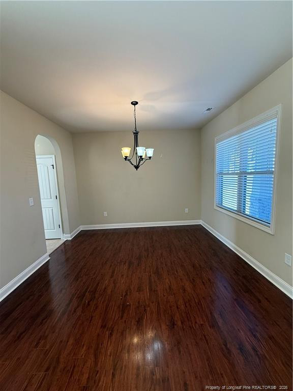 22 Raintree Lane Spring Lake, NC 28390 - Photo 4 of 25 an empty room with wooden floor cabinet and windows