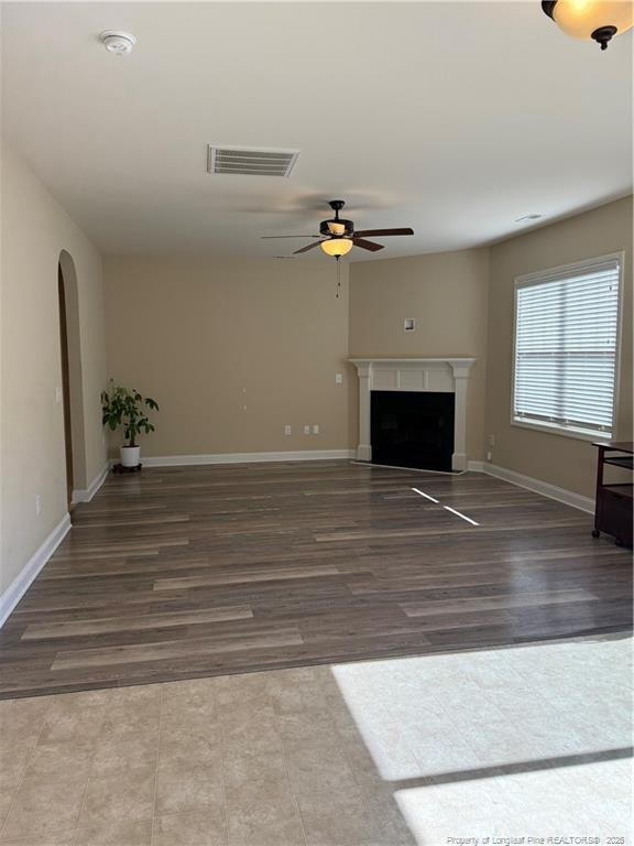 22 Raintree Lane Spring Lake, NC 28390 - Photo 7 of 25 wooden floor in an empty room with a fireplace