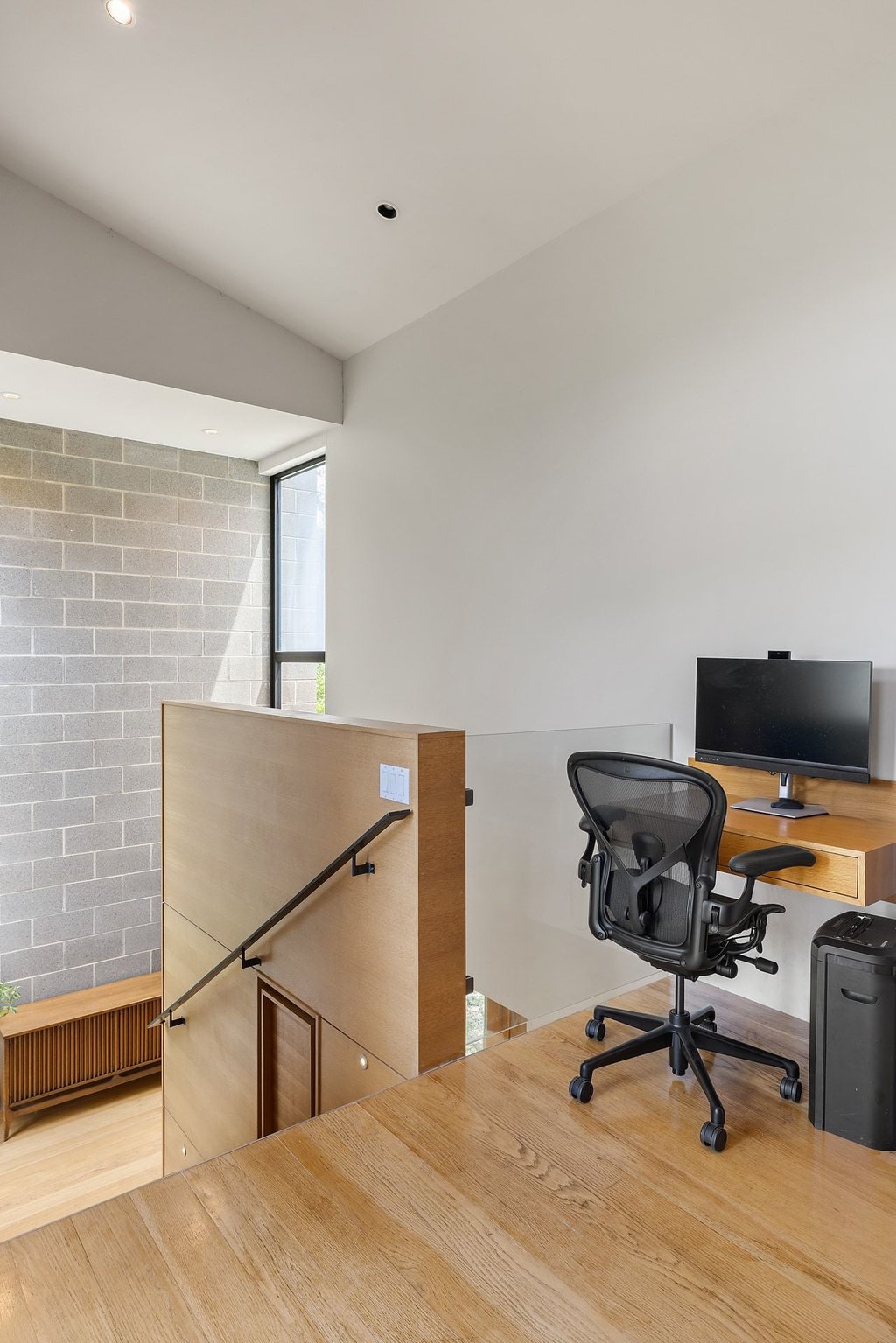 801 The High Road Austin, TX 78746 - Photo 24 of 40 a workspace with furniture and a window