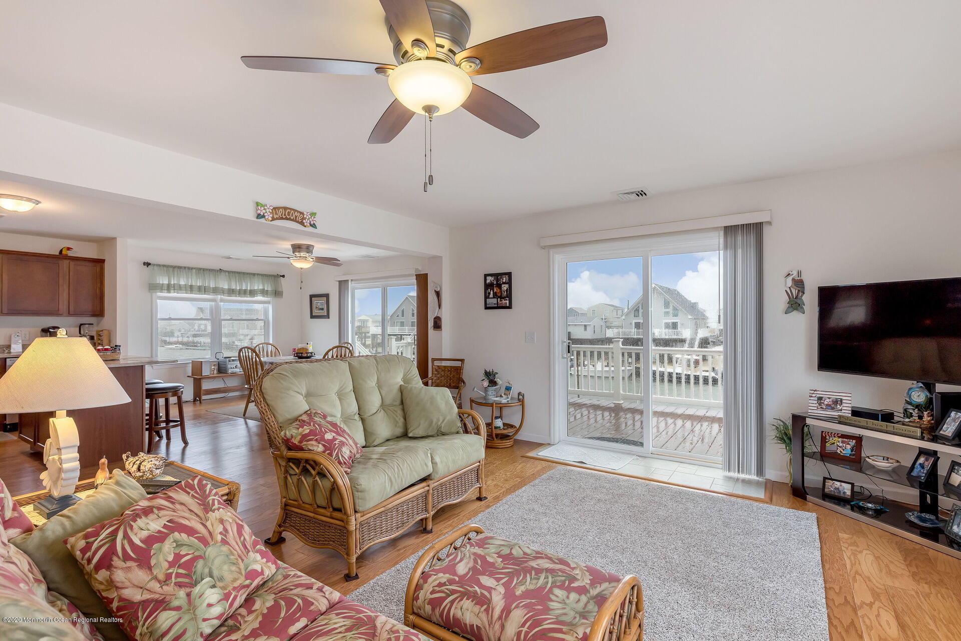 139 Flamingo Road Tuckerton, NJ 08087 - Photo 2 of 22 a living room with furniture a flat screen tv and a large window