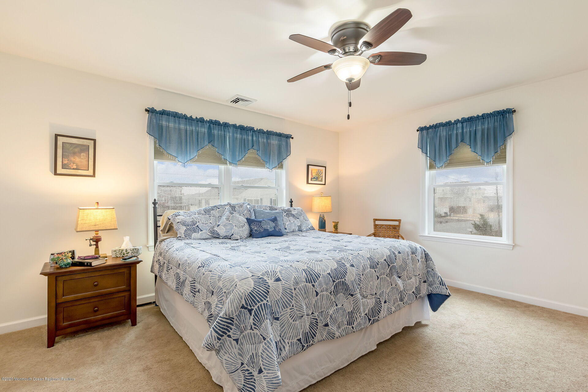 139 Flamingo Road Tuckerton, NJ 08087 - Photo 11 of 22 a bedroom with a bed chandelier and a window
