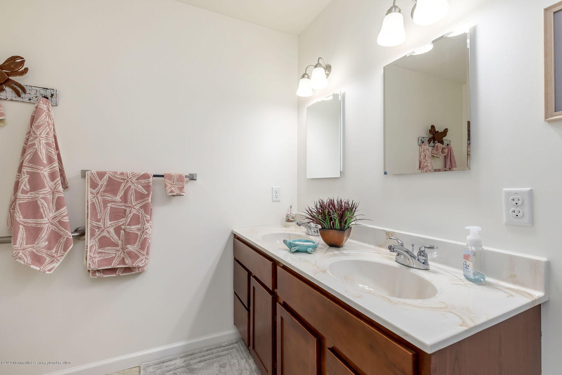 139 Flamingo Road Tuckerton, NJ 08087 - Photo 13 of 22 a bathroom with a sink and a mirror
