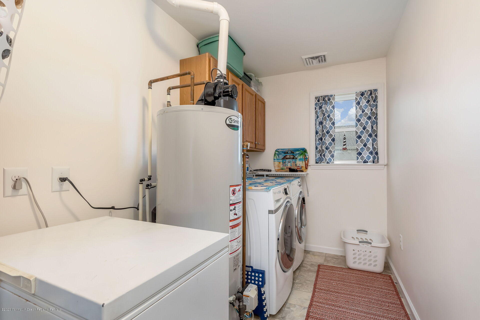 139 Flamingo Road Tuckerton, NJ 08087 - Photo 14 of 22 a room with refrigerator and washer