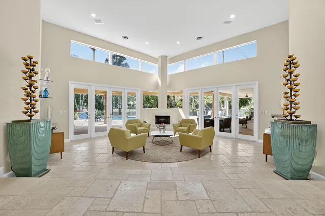a living room with furniture and kitchen view