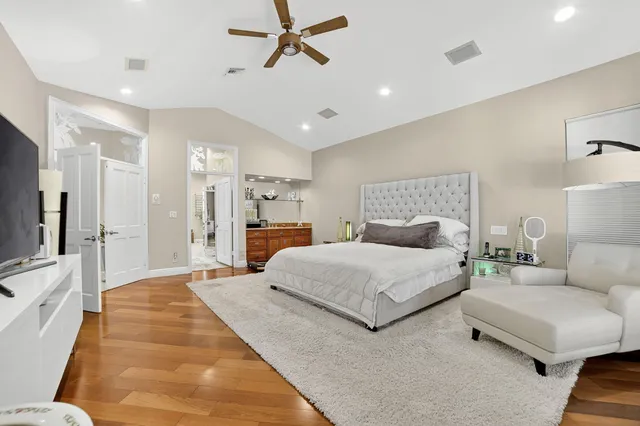 a spacious bathroom with a double vanity sink a mirror and a bathtub