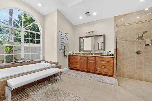 a kitchen with granite countertop white cabinets stainless steel appliances and a sink