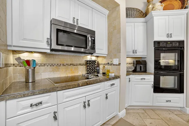 a bathroom with a shower a toilet and a window