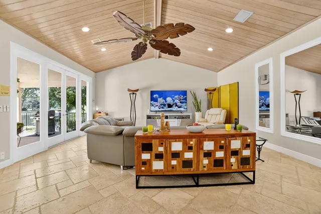 a bedroom with a bed furniture and a large window