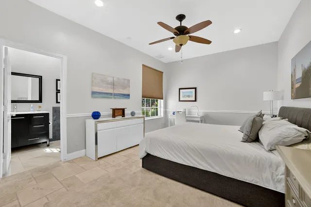 a view of a house with swimming pool and sitting area