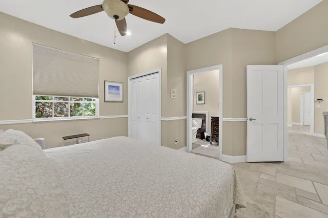 a picture of a room with a white wall and a window