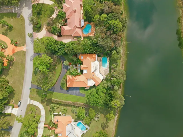 an aerial view of a house with yard