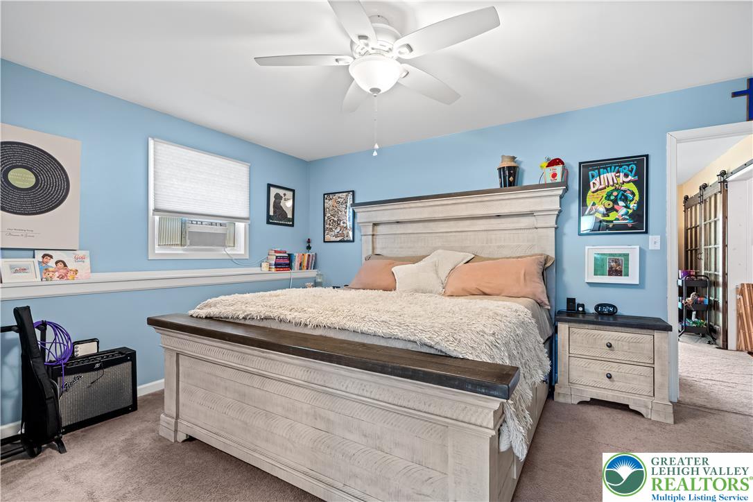 50 Kohls Road Northampton, PA 18067 - Photo 29 of 54 Relax in this tranquil bedroom, featuring a window and a ceiling fan for comfort.