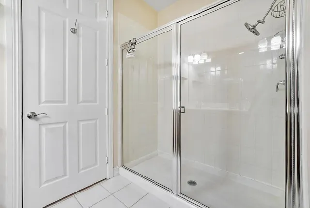 a bathroom with a glass shower door