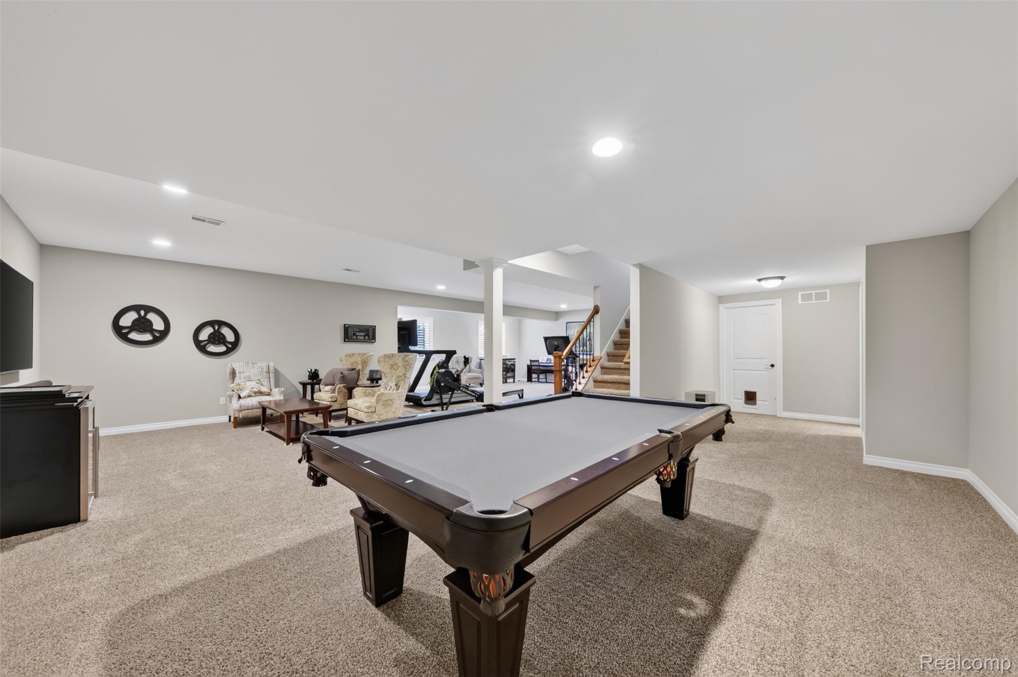 2531 Walnut View Drive Howell, MI 48855 - Photo 26 of 34 Spacious recreational area featuring a billiard table, neutral carpeting, recessed lighting, and a white paneled door