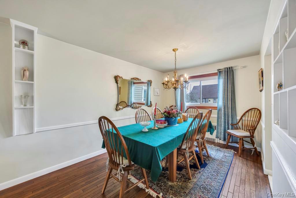 7 North Terrace Place Valley Stream, NY 11580 - Photo 16 of 40 a view of a dining room with furniture and wooden floor