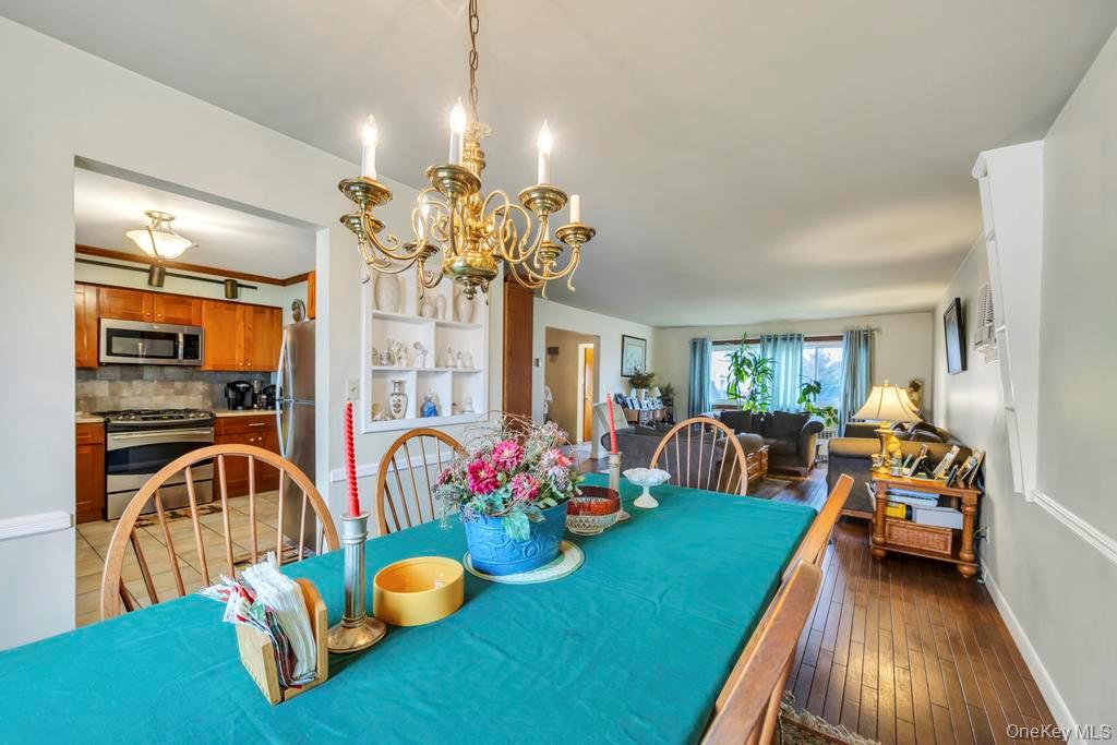 7 North Terrace Place Valley Stream, NY 11580 - Photo 17 of 40 a bedroom with furniture and a chandelier
