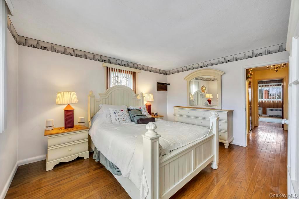 7 North Terrace Place Valley Stream, NY 11580 - Photo 21 of 40 a bed room with a bed and a night stand