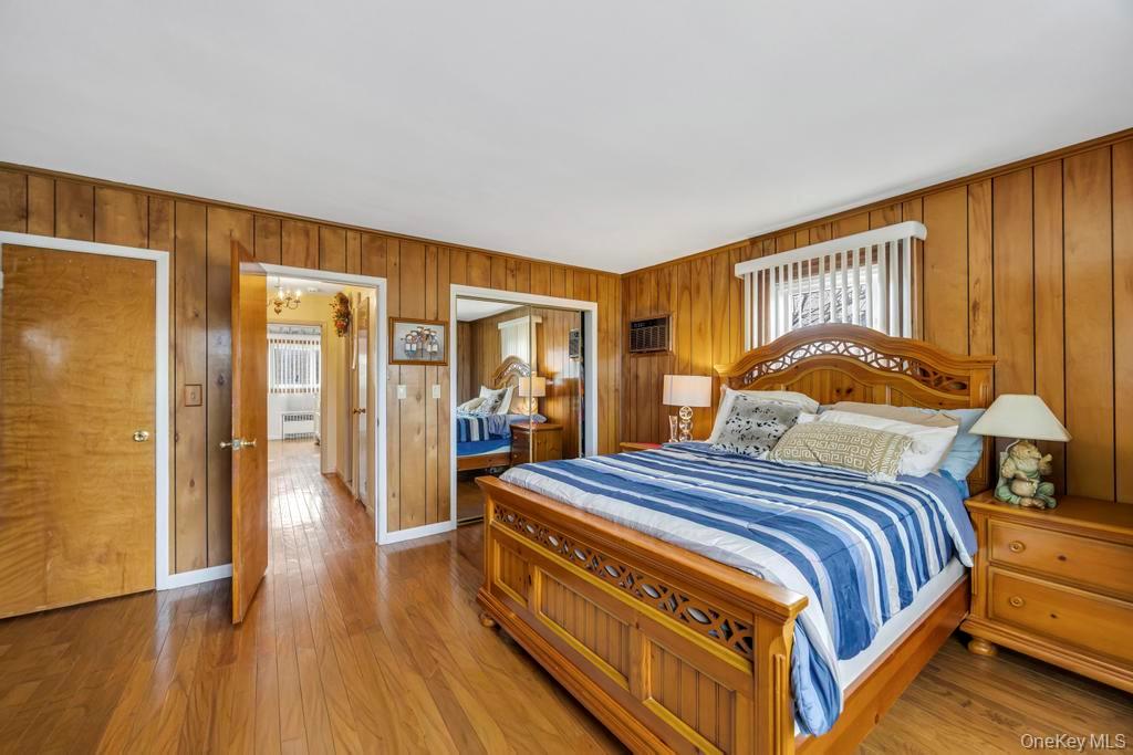 7 North Terrace Place Valley Stream, NY 11580 - Photo 24 of 40 a bedroom with a bed and wooden floor